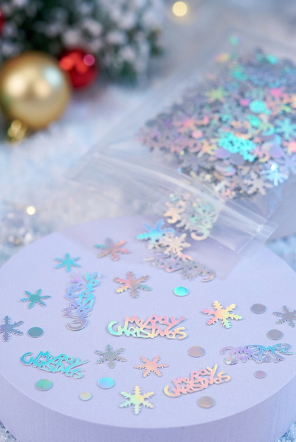 Close-up of iridescent snowflake, circle and Merry Christmas confetti